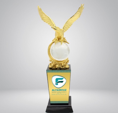 Eagle statue with ball and black base