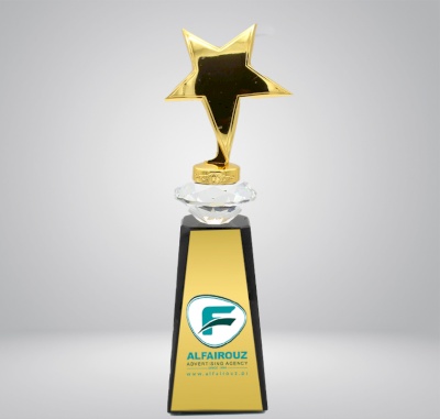 Gold star statue with black base