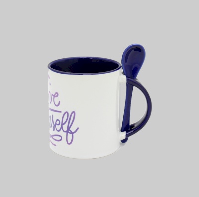 Dark blue interior white mug with dark blue handle and spoon